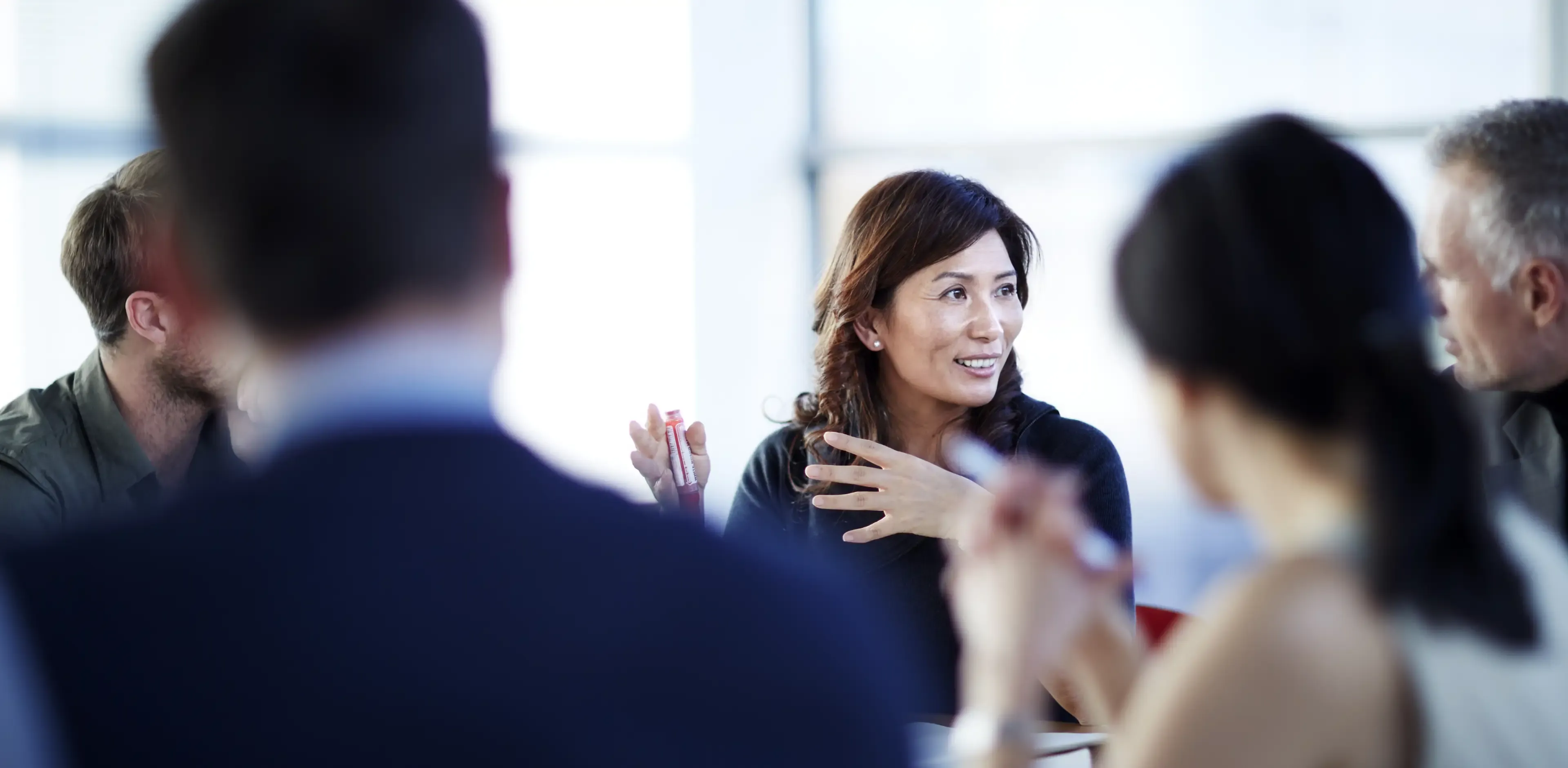 Business people talking in a meeting Business people talking in a meeting